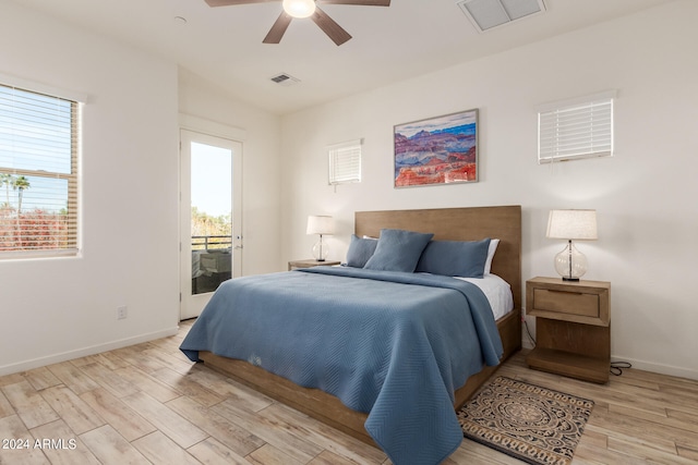 bedroom with ceiling fan, light hardwood / wood-style flooring, and access to exterior