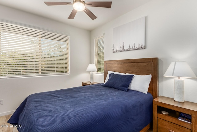 bedroom featuring ceiling fan and hardwood / wood-style floors