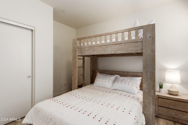 bedroom featuring wood-type flooring