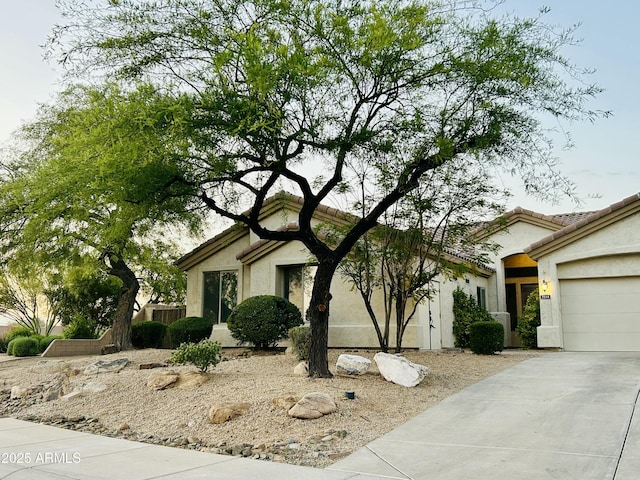 7214 E Rustling Pass, Scottsdale, AZ 85255 - view of front of home featuring driveway, an attached garage, and stucco siding