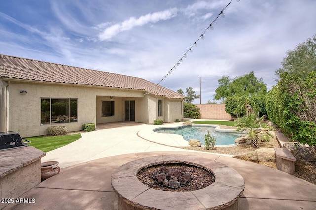 7214 E Rustling Pass, Scottsdale, AZ 85255 - view of pool with an outdoor fire pit, a patio, a fenced backyard, and ceiling fan