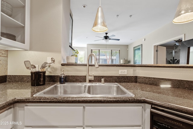 3633 N 3rd Ave Unit 1035, Phoenix, AZ 85013 - kitchen with a sink, dishwasher, white cabinets, and dark countertops