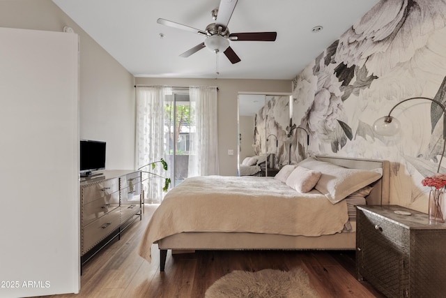 3633 N 3rd Ave Unit 1035, Phoenix, AZ 85013 - bedroom featuring access to exterior, wood finished floors, and a ceiling fan
