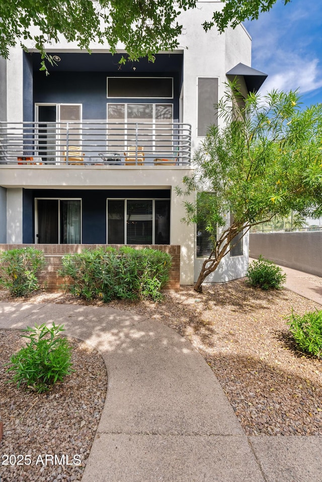 3633 N 3rd Ave Unit 1035, Phoenix, AZ 85013 - back of house featuring a balcony and stucco siding