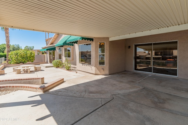 view of patio / terrace featuring an outdoor fire pit