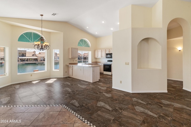 kitchen featuring an inviting chandelier, high vaulted ceiling, hanging light fixtures, and white electric range