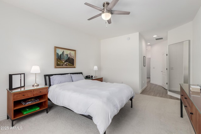 bedroom with light carpet, baseboards, ceiling fan, and recessed lighting