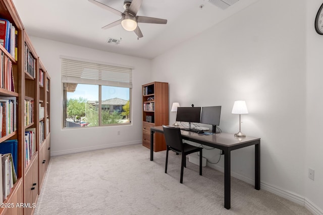 office area featuring carpet flooring, ceiling fan, and baseboards
