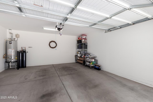 garage featuring gas water heater, a garage door opener, and baseboards
