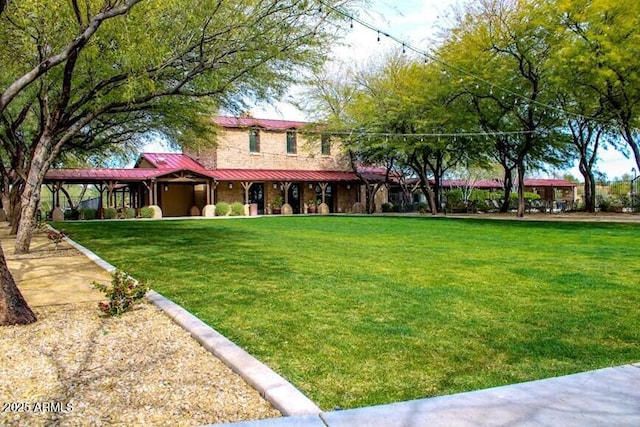 view of front of home with a front lawn, a porch, and metal roof