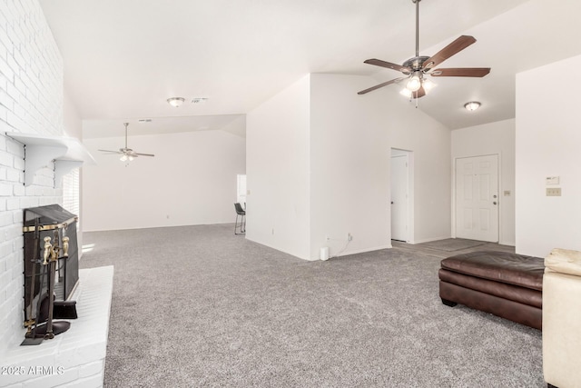 living room with a fireplace, lofted ceiling, and carpet flooring