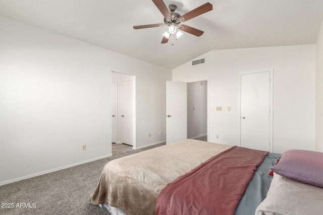 bedroom featuring ceiling fan, light carpet, and vaulted ceiling