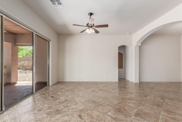 14657 N 103rd Way, Scottsdale, AZ 85255 - unfurnished room featuring ceiling fan and arched walkways