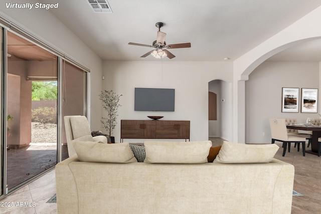 14657 N 103rd Way, Scottsdale, AZ 85255 - living area featuring ceiling fan and arched walkways