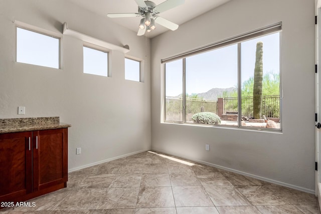 14657 N 103rd Way, Scottsdale, AZ 85255 - empty room featuring a ceiling fan and baseboards