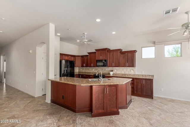14657 N 103rd Way, Scottsdale, AZ 85255 - kitchen with black appliances, a ceiling fan, backsplash, light stone counters, and recessed lighting