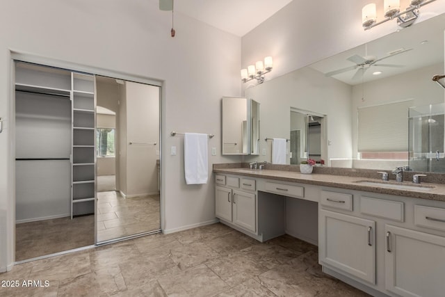 14657 N 103rd Way, Scottsdale, AZ 85255 - bathroom featuring double vanity, ceiling fan, and an enclosed shower
