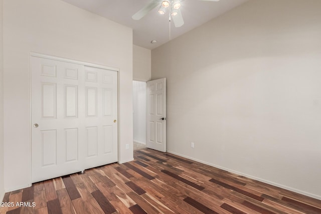 14657 N 103rd Way, Scottsdale, AZ 85255 - unfurnished bedroom with wood finished floors, a closet, a ceiling fan, and a high ceiling