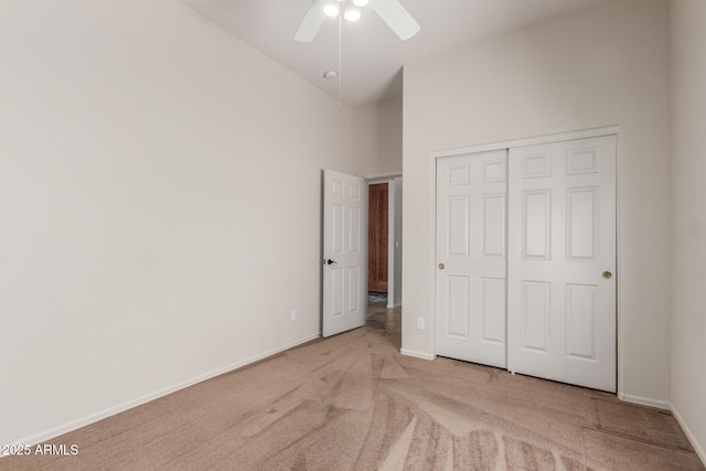 14657 N 103rd Way, Scottsdale, AZ 85255 - unfurnished bedroom featuring carpet flooring, a closet, a towering ceiling, and a ceiling fan