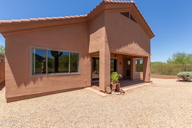 14657 N 103rd Way, Scottsdale, AZ 85255 - back of house featuring a patio, a ceiling fan, and stucco siding