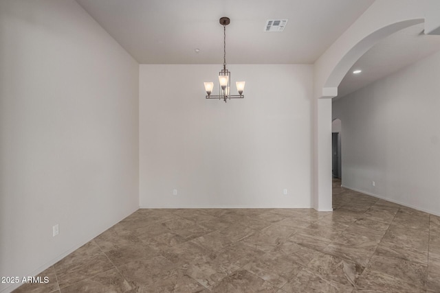 14657 N 103rd Way, Scottsdale, AZ 85255 - spare room featuring arched walkways and a chandelier