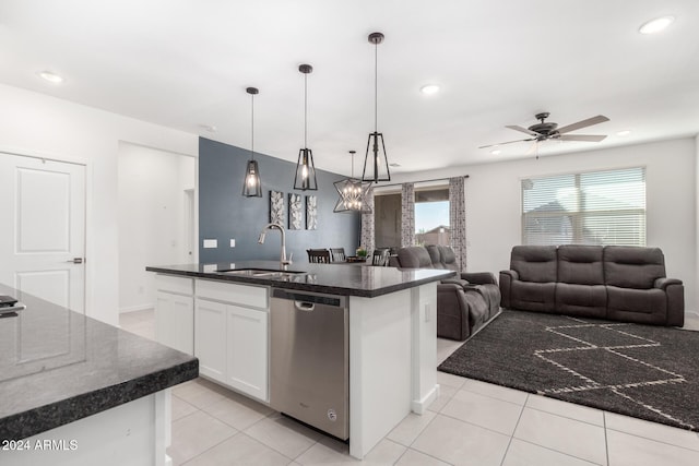 kitchen with stainless steel dishwasher, a kitchen island with sink, sink, pendant lighting, and white cabinets