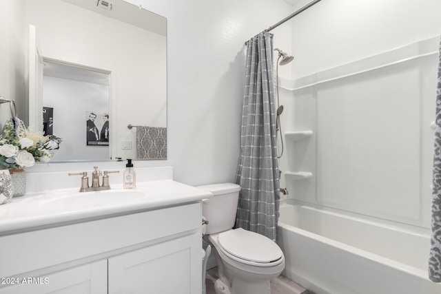 full bathroom with vanity, toilet, and shower / bath combo with shower curtain