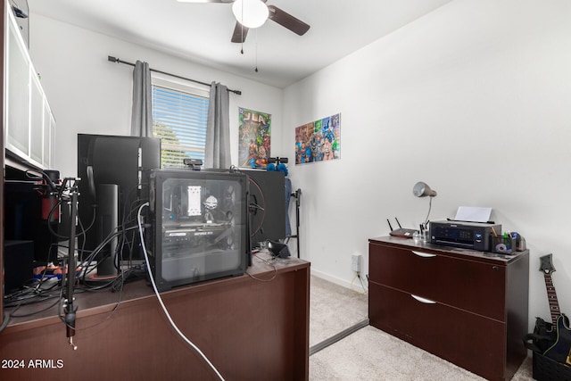 carpeted home office with ceiling fan