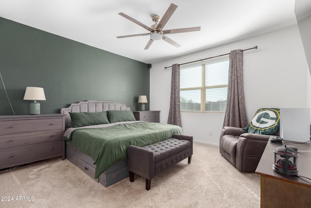 bedroom featuring ceiling fan and light colored carpet