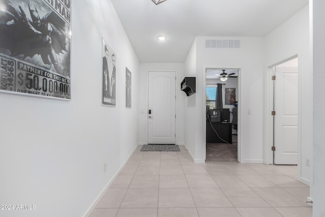 corridor featuring light tile patterned flooring