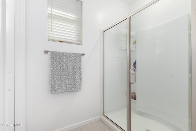 bathroom featuring tile patterned flooring and walk in shower