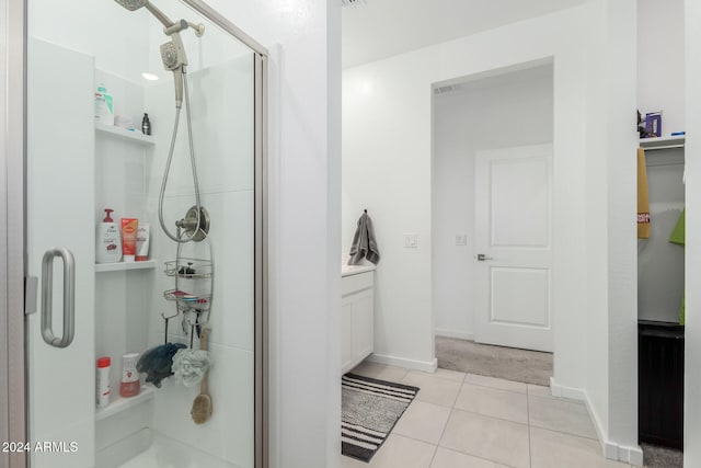 bathroom with tile patterned floors and a shower with shower door