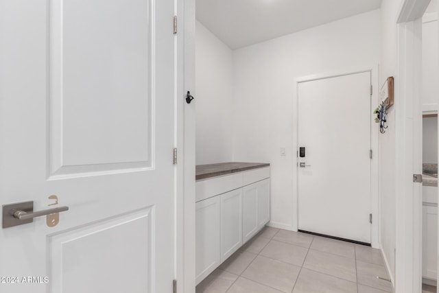 entryway featuring light tile patterned floors