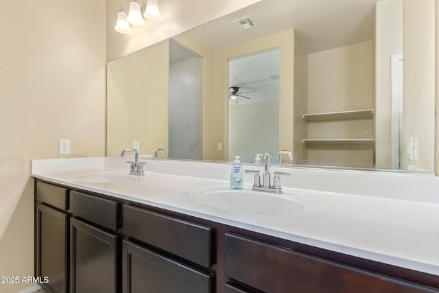 full bathroom with a ceiling fan, visible vents, a sink, and double vanity