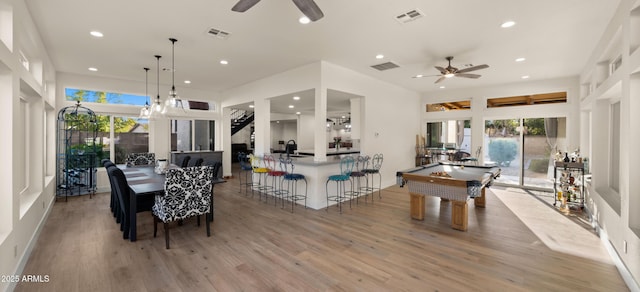 dining space featuring pool table, visible vents, and light wood-style floors