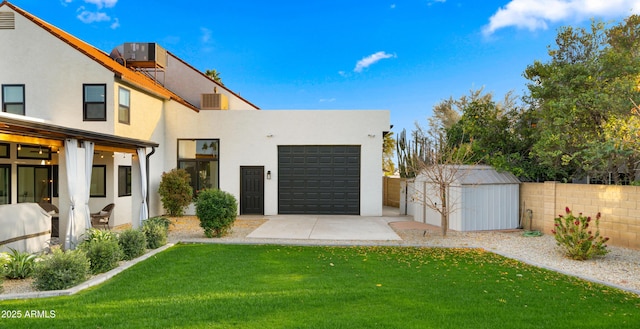 exterior space with fence, a front lawn, and stucco siding