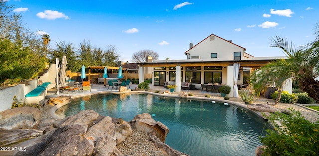 pool featuring a patio and fence