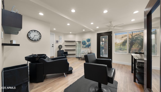 living area featuring a ceiling fan, recessed lighting, baseboards, and light wood finished floors