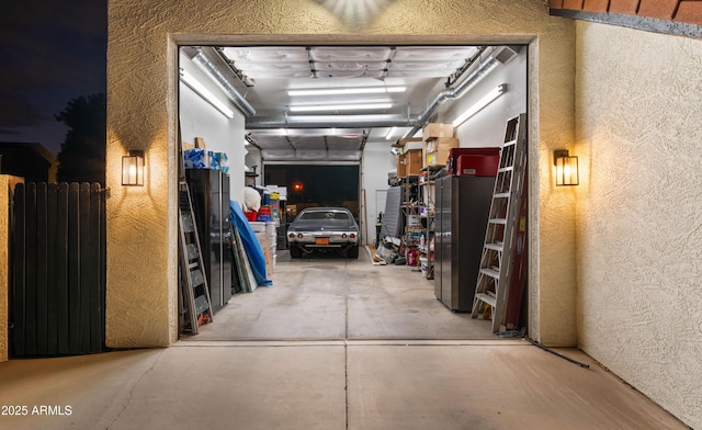 interior space with a textured wall and unfinished concrete flooring