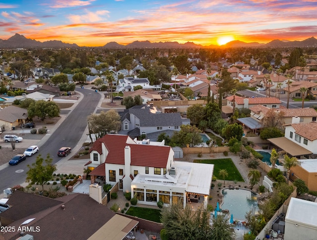 drone / aerial view featuring a residential view and a mountain view