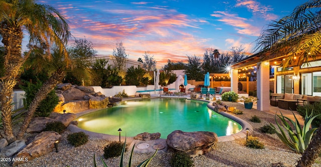 view of pool with a fenced in pool, a patio, fence, and an outdoor hangout area