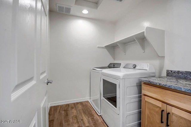 laundry area with attic access, baseboards, visible vents, dark wood-type flooring, and independent washer and dryer