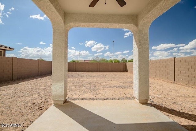 view of patio with a fenced backyard and a ceiling fan