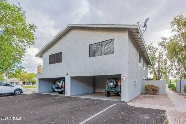 view of property exterior featuring a garage