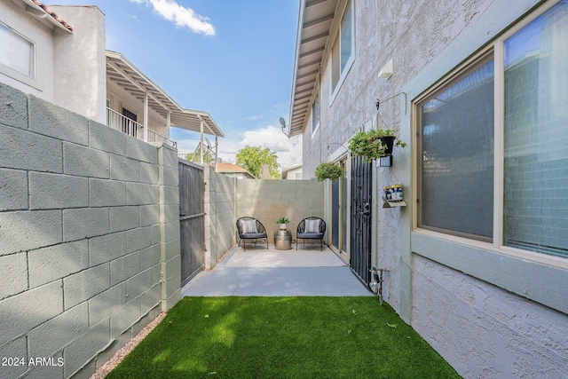 exterior space featuring a patio area and a fenced backyard