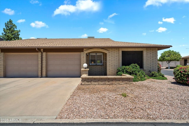 520 S Greenfield Rd Unit 7, Mesa, AZ 85206 - single story home featuring concrete driveway, a garage, and brick siding