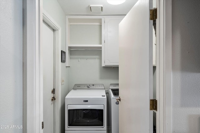 520 S Greenfield Rd Unit 7, Mesa, AZ 85206 - laundry area featuring washing machine and clothes dryer and cabinet space