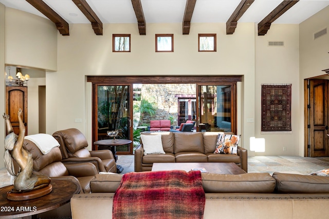 living room with beamed ceiling and a chandelier