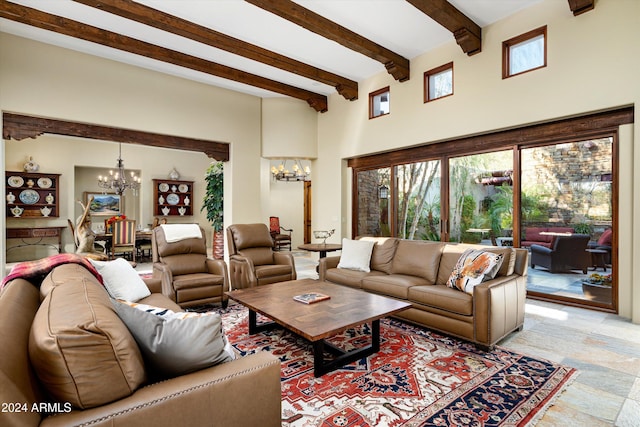 living room with an inviting chandelier and beam ceiling