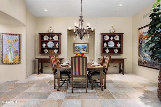 dining room with a notable chandelier